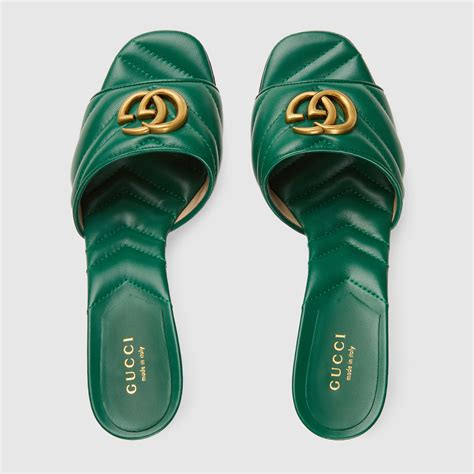 Gucci Sandalias tipo chancla con letras G entrelazadas para mujer